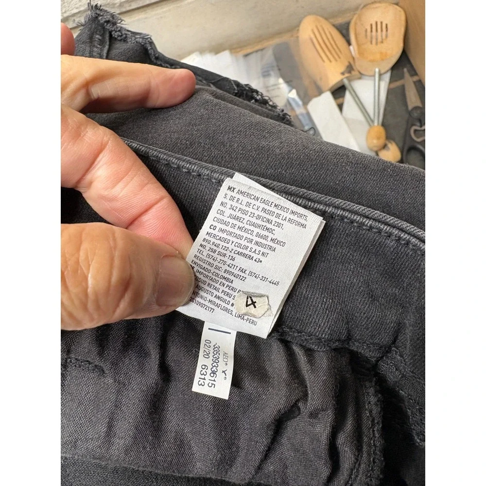 American Eagle Distressed Denim Mini Skirt Washed‎ Black Raw Hem Womens Size 10
